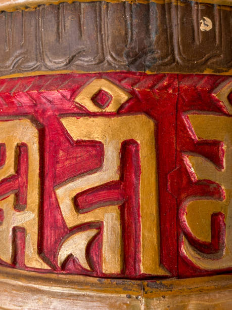 istock A gold and red prayer wheel with writing in a foreign language, spiti valley, India 2187664336