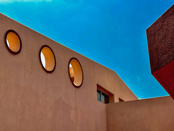 istock The building has three windows with a blue sky in the background 2187665207