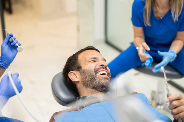 istock A humorous moment shared during a dental appointment. 2187666978