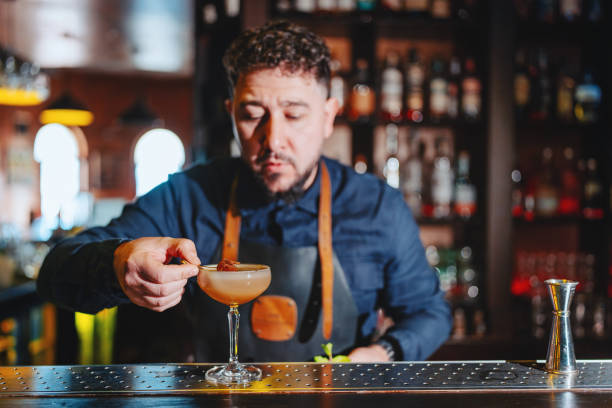 istock Bartender garnishing a Daiquiri cocktail in the pub 2187667200