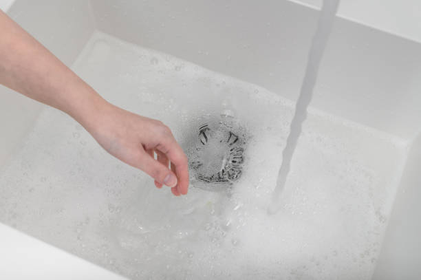 istock Clogging sink fault, water does not drain 2187668473