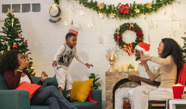 istock Festive Black Family Christmas Gathering and Celebration 2187670828