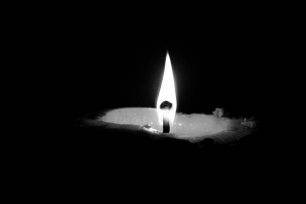 istock A candle burning in the dark, a candle's light in the dark 2187674225