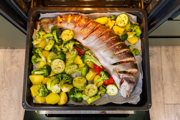 istock Oven-baked trout with vegetables 2187676218