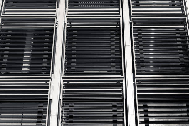 istock Modern building facade with sleek window blinds showcasing architectural design details in an urban setting 2187676369