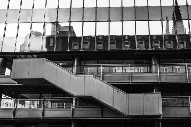 Urban architecture with reflections showcasing modern design and historical elements in a city setting