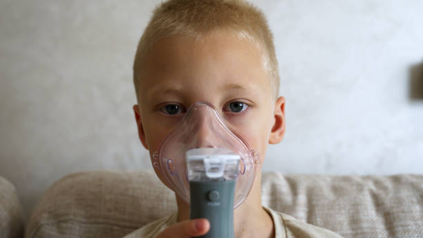 istock Sick Boy Undergoes Inhalation Treatment at Home for Colds and Asthma 2187676903