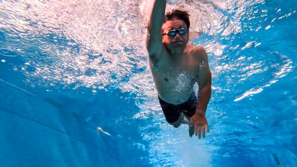 istock Asian Male Athlete Swimming 2187677695