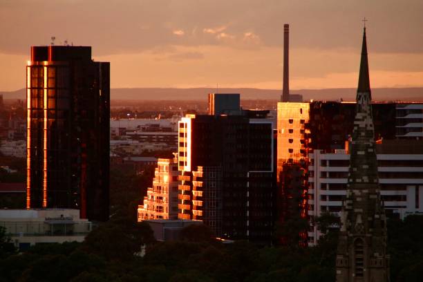 istock Sunset reflecting off city skyline 2187679099