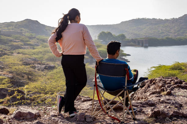istock people Relaxing on Camping site with Lake View at Sunrise 2187680332