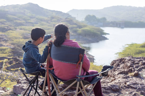 istock Mother and Son Bonding at Mountain Top with Lake View 2187680839