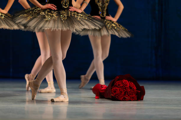 Closeup of ballerinas dancing on stage. Closeup of ballerinas legs