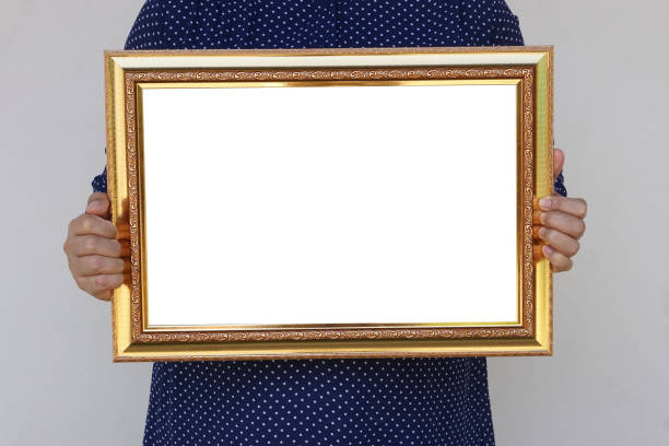 istock Closeup woman holds empty photo frame or blank diploma certificate frame. Copy space for adding text or photos. Concept, Proud, memories and nostalgia . 2187681811