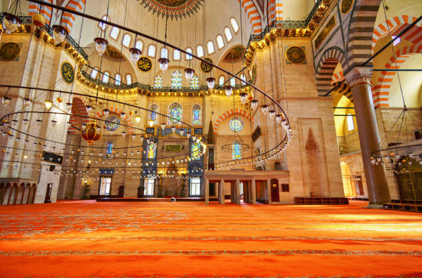istock interior of mosque, domes are painted with patterns, decorative windows and columns, chandeliers, beautiful architecture of Islamic religion, Istanbul, Turkey 2187683737