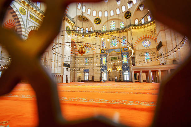 istock interior of mosque, domes are painted with patterns, decorative windows and columns, chandeliers, beautiful architecture of Islamic religion, Istanbul, Turkey 2187683749