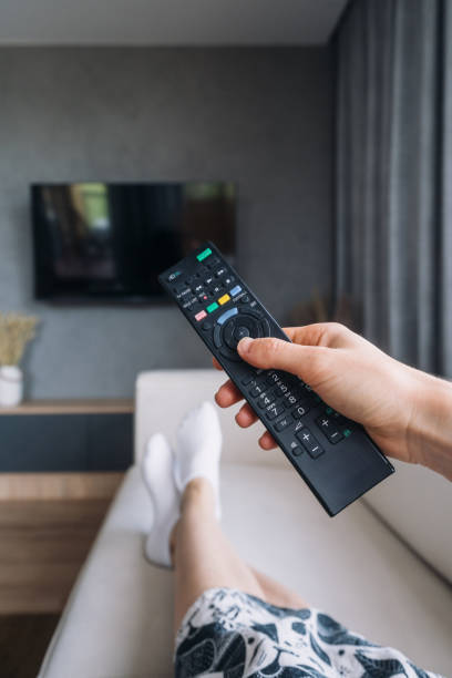 istock Relaxing in a modern apartment while enjoying entertainment on the TV 2187684482