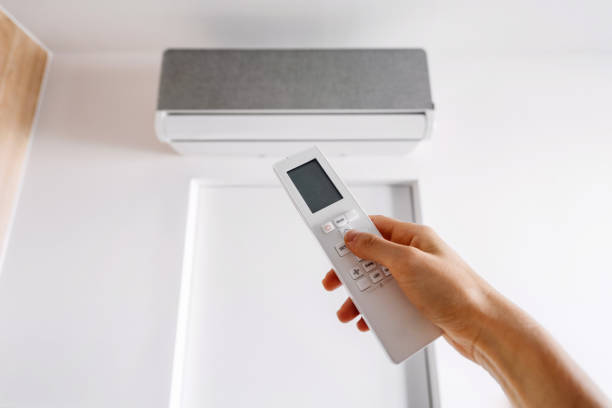 istock Remote control adjustment of an air conditioning unit for indoor comfort 2187684563