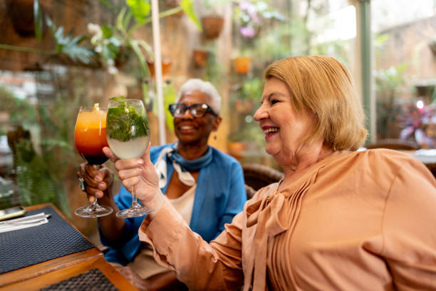 istock Senior friends toasting at a restaurant 2187686384