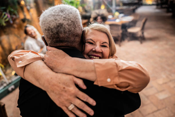 istock Senior couple embracing at a restaurant 2187686566