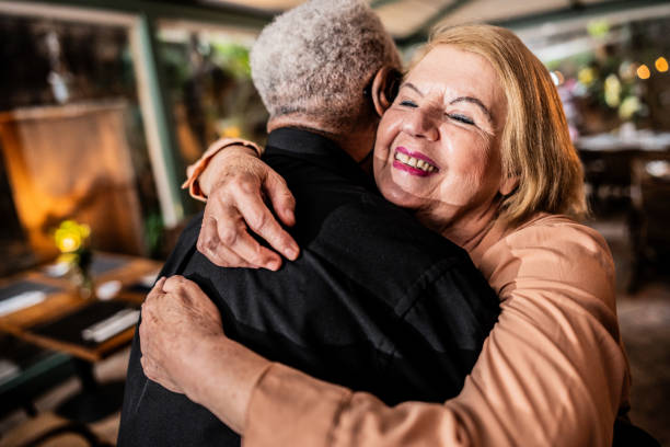 istock Senior couple embracing at a restaurant 2187686573