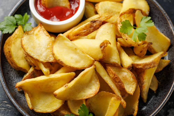 istock Fried potato dippers with ketchup on a plate 2187691210