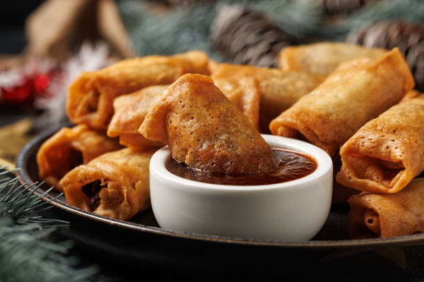istock Christmas duck spring rolls with decoration, gifts, green tree branch 2187691375
