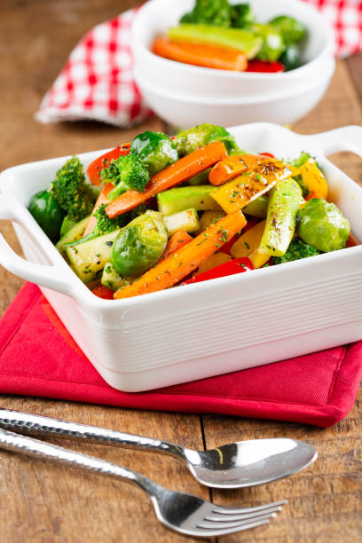 istock Stir-fried Vegetables with vibrant colors on a wooden table 2187694006