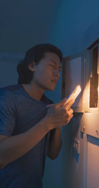 istock asian man with power outage 2187694553