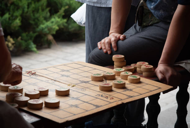 istock Two people playing xiangqi, chinese chess. 2187695633