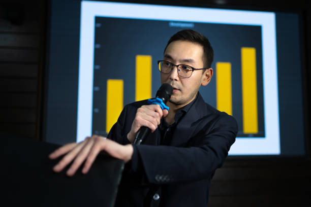 istock Professional confident speaker in glasses replying questions during seminar 2187699032