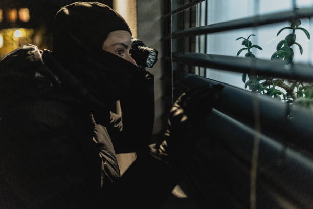 istock Masked thief trying to break in 2187699679