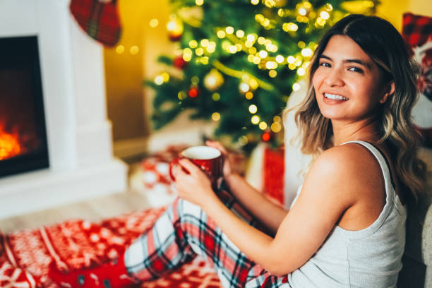 istock Happy woman at home during Christmas 2187702913