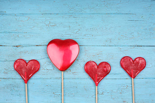 istock red candy hearts on blue old wooden planks, love 2187702998