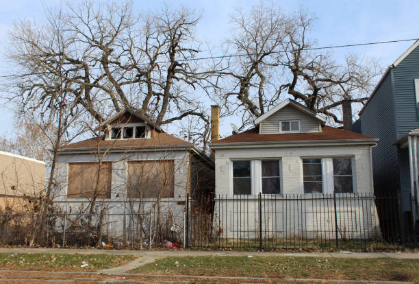 istock Two abandoned Chicago style bungalows in Englewood on the South Side 2187703651