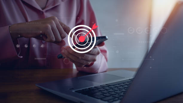 istock Target board inside magnifying glass for focus business objective on gray background and copy space. Search, goal, strategy, success. 2187704402