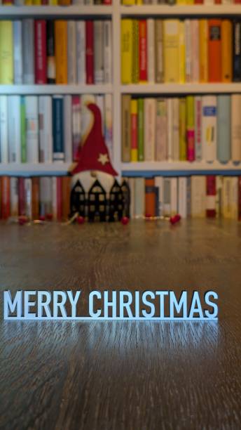 Merry christmas text illuminated in the library