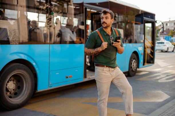 istock Urban Discontent: Man Checking Public Transport Times on Phone 2187710861