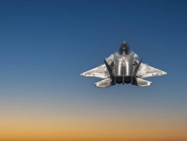 istock Military Jet Performing a Dynamic Maneuver During a Vibrant Sunset in the Sky 2187710963