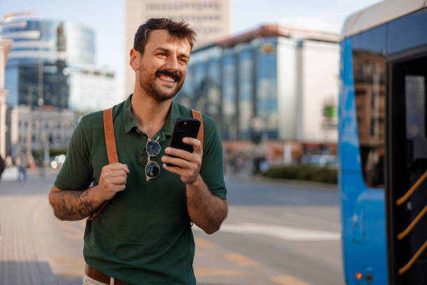 istock Social and Urban: Happy Man Enjoying Technology in City Streets 2187711546