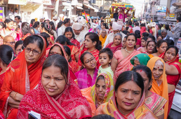 Beawar, Rajasthan, India, November 29, 2024: Members of jain community take part in a chariot procession of 28-year-old software engineer Harshali Kothari during her initiation ceremony in Beawar. Harshali quits job with INR 3.2 million annual package to become sadhvi (jain nun). Beawar residents Ashok Kothari and Usha Kothari's daughter Harshali decided not to get married and also adopted the vow of celibacy. She will be leaving her family and other relations to adopt simple life of a sadhvi on December 3.