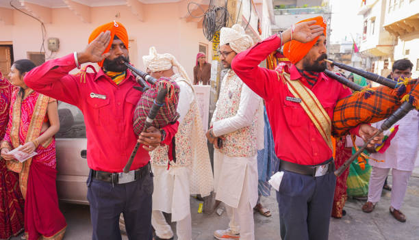 Cheerful Sikh men of rural village, near Amritsar, Punjab, India. The Punjab, is the state which is the heart of India’s Sikh community, bordering Pakistan. The city of Amritsar is best known for Harmandir Sahib, the holiest gurdwara, or Sikh place of worship and a major pilgrimage site. The distinctive Golden Temple, as it is known in English, is surrounded by the Pool of Nectar.