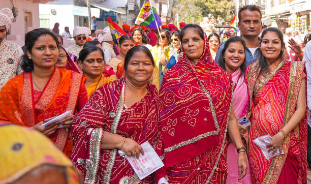 Beawar, Rajasthan, India, November 29, 2024: Members of jain community take part in a chariot procession of 28-year-old software engineer Harshali Kothari during her initiation ceremony in Beawar. Harshali quits job with INR 3.2 million annual package to become sadhvi (jain nun). Beawar residents Ashok Kothari and Usha Kothari's daughter Harshali decided not to get married and also adopted the vow of celibacy. She will be leaving her family and other relations to adopt simple life of a sadhvi on December 3.