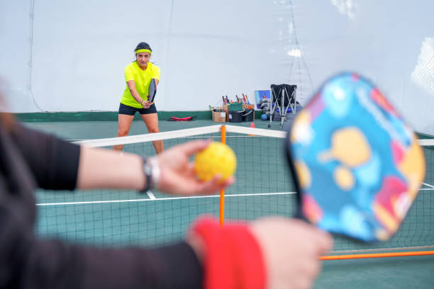 istock A mature woman Practicing Pickleball Indoors 2187713355