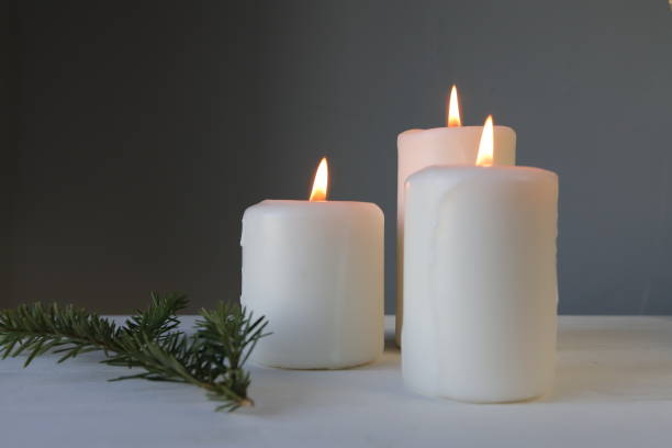 istock christmas candle on a dark background 2187714234