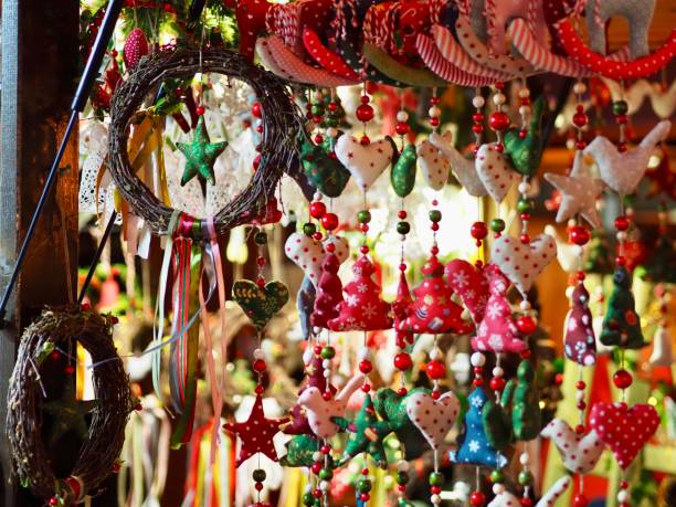istock Various colorful hanging decorations, including stars, hearts, and trees, dangle beautifully from a Christmas market stall, creating a vibrant festive atmosphere. 2187715647
