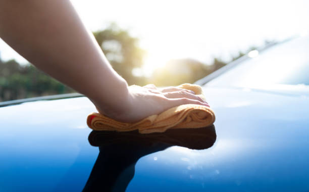 istock Woman hand cleaning car with a cloth 2187716162