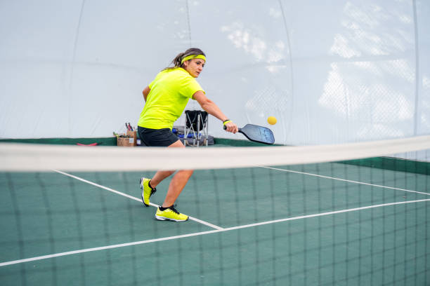 istock A mature woman Practicing Pickleball Indoors 2187716842
