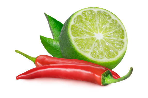 istock Lime slice and chili peppers on an isolated white background. 2187716963