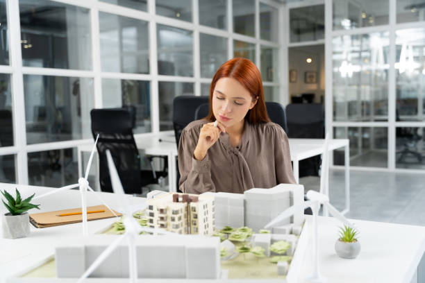 istock Ginger young woman working in the modern office 2187722963