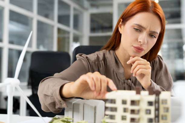istock Young female architect working on a project and looking focused 2187722986